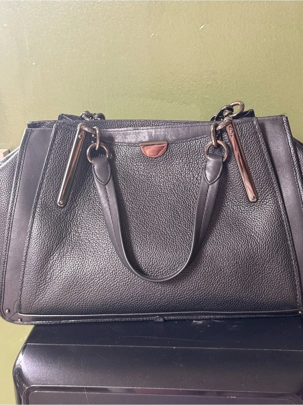 Coach polished pebble